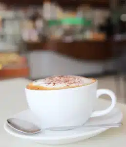 Close-up of hot coffee and cappuccino at Kacks Cafe.