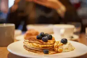 Sweet pancakes with caramel syrup and blueberries, Kacks Cafe all day breakfast.